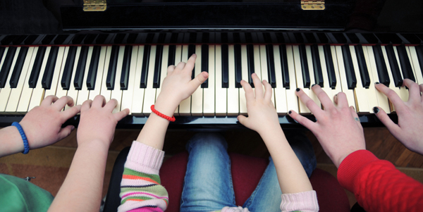 children play piano